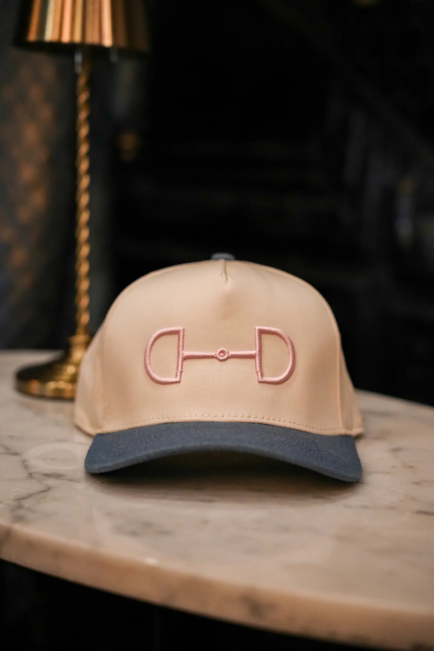 Pink horse bit trucker hat